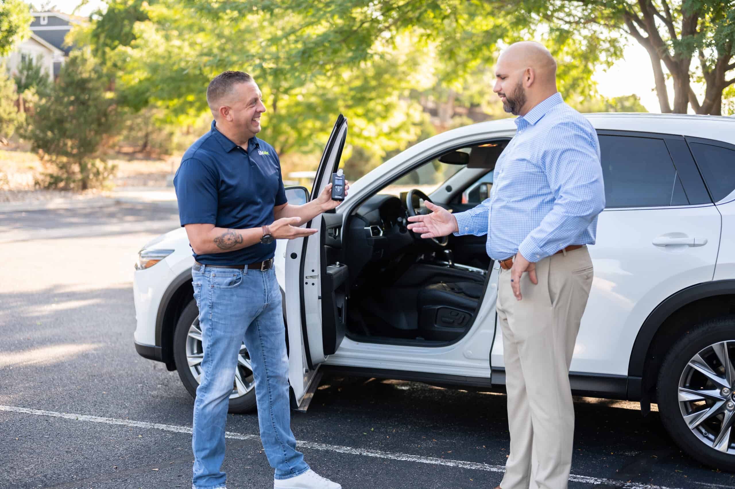 Technician expertly installing an ignition interlock device in a vehicle, showcasing available discounts for the service